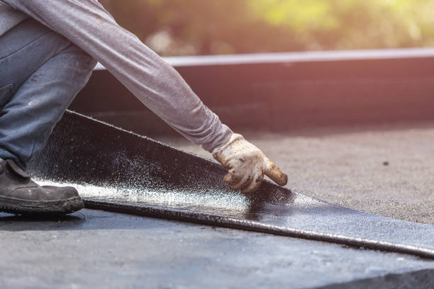 Professional Basement Waterproofing technician working in Martin, TN
